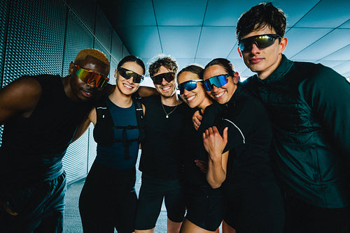 Friends join a running group portrait with sporty sunglasses before a club workout