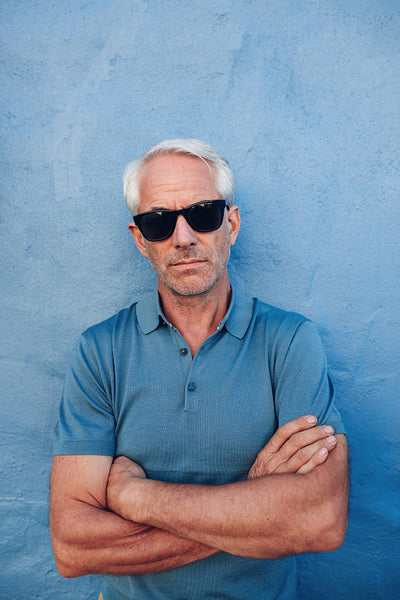 Stylish mature man wearing sunglasses