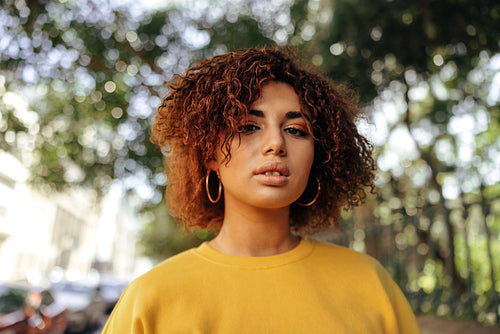 Fashionable teenage girl looking at the camera