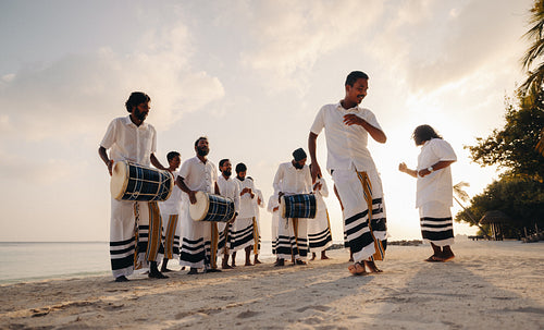 Cultural dance and drumming show for guests at luxury beach resort