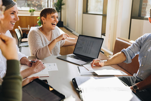 Smiling businesswoman in project discussion