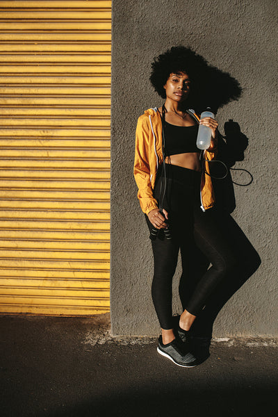 Sporty woman relaxing after running