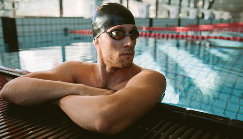 Professional male swimmer resting