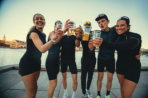 The running friends unwind with beer after the run by the canels