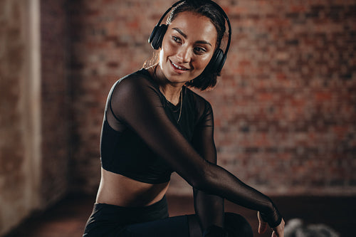 Woman taking break after workout at gym