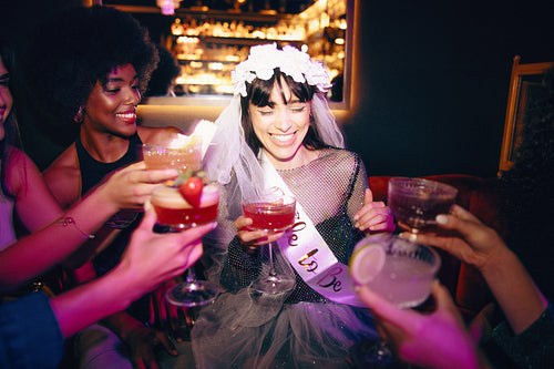 Bride-to-be celebrating at a vibrant bachelorette party with friends