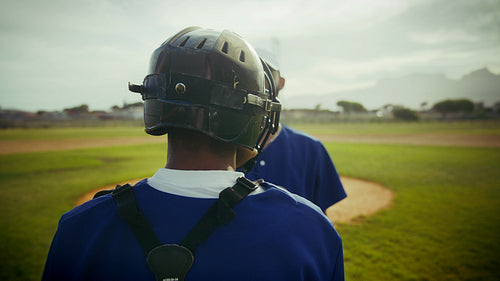 Catcher stands ready on the baseball diamond