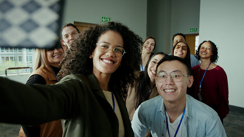 Smiling people taking a group photo