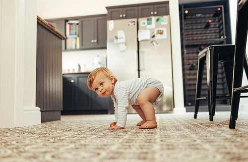 Baby trying to stand on his feet