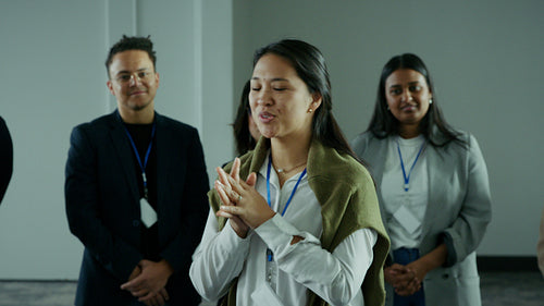 Young business professionals engaging in conversation and collaboration at a corporate conference event