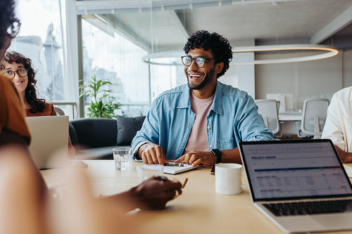 Young business professionals collaborating on a project in a modern office