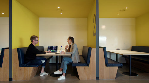 Coding experts having a discussion in a coworking office