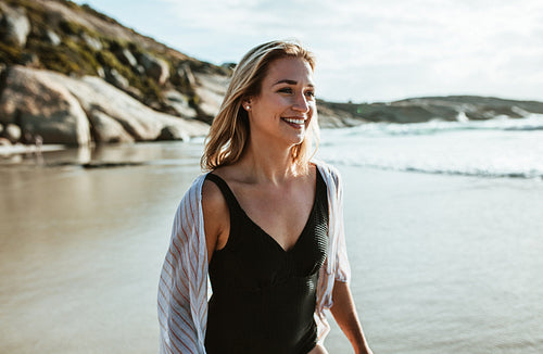 Woman walking along the beach
