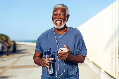 Smiling senior Black man enjoying a morning run