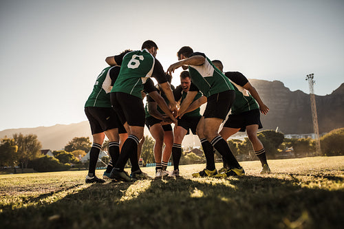 Rugby players cheering and celebrating win