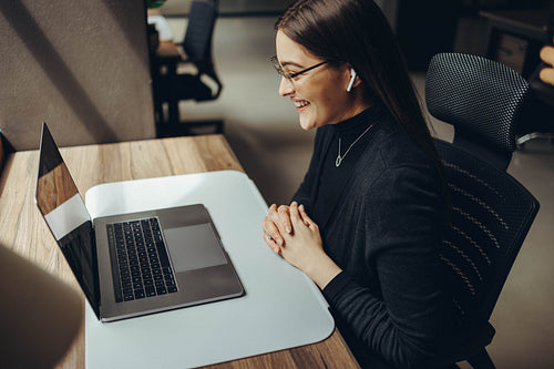 Female business professional attending an online meeting