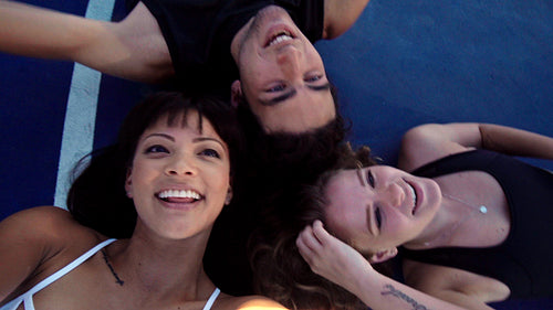 Overhead view of happy friends taking a fun group selfie