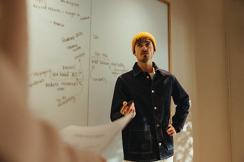 Man explains strategy during a business meeting