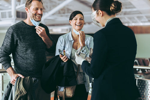 Traveler couple excited to board a flight during pandemic