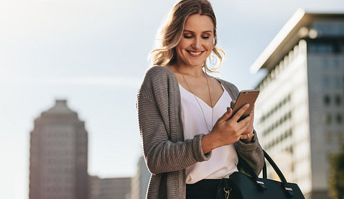 Real estate agent using phone while commuting