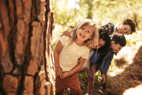 Kids playing hide and seek in a park