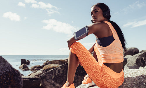 Fit woman relaxing after running workout