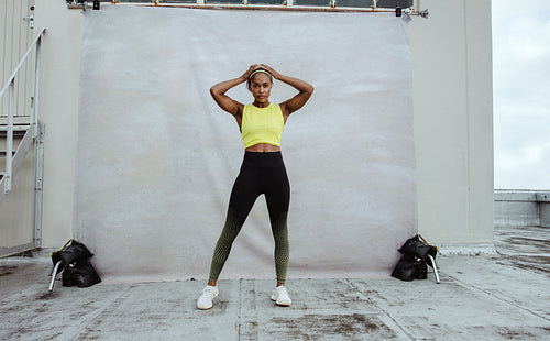 African fitness woman relaxing on rooftop