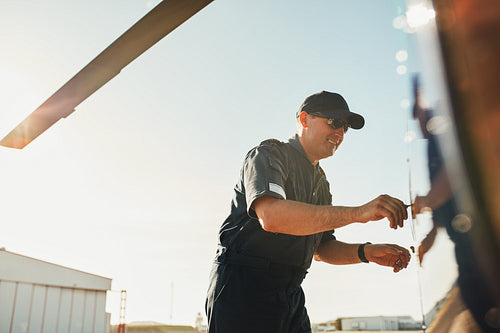 Pilot preparing his helicopter for flight