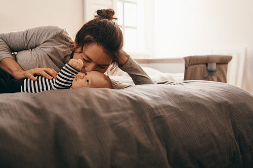 Mother pampering her baby