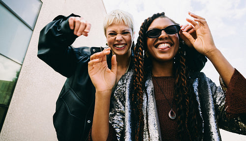 Fashionable women make funny faces in the city