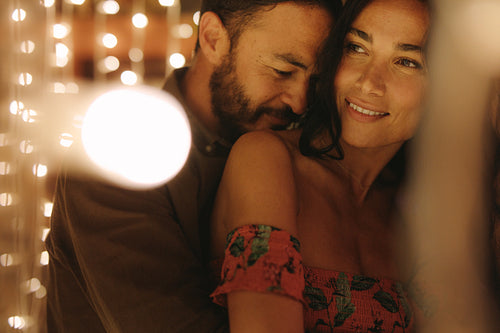 Loving young couple at a party