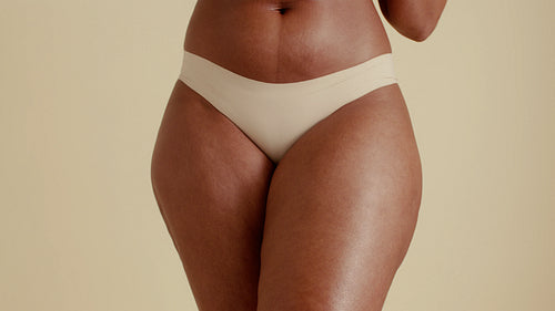 Female wellness - Woman and razor on thigh