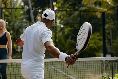 Padel coach demonstrating technique