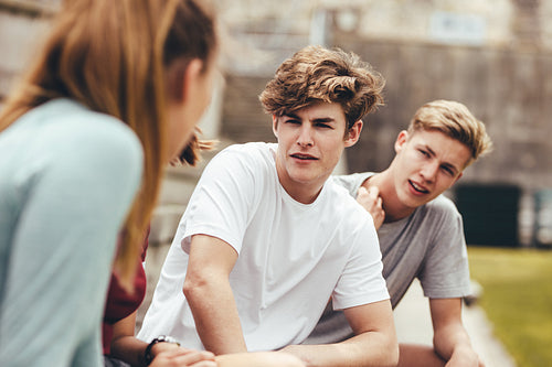 Group of friends sitting at school campus