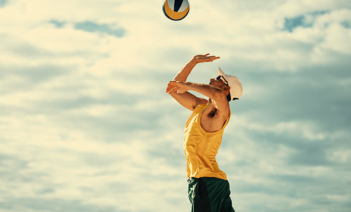 Australian athlete blocking ball at beach volleyball championships