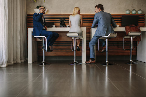 Passengers at free internet service counter in airport