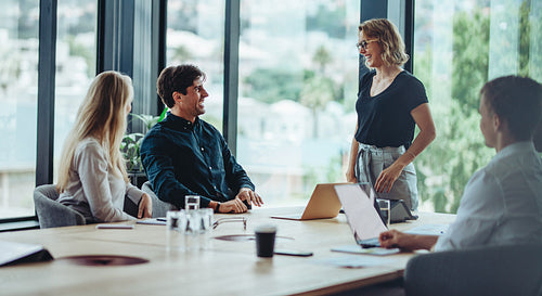 Group of happy corporate people in a meeting