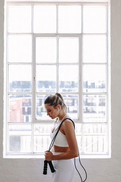Portrait of a fitness woman with skipping rope
