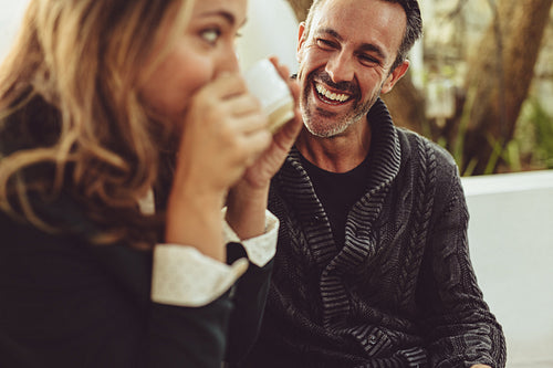 Happy couple sitting at coffee shop