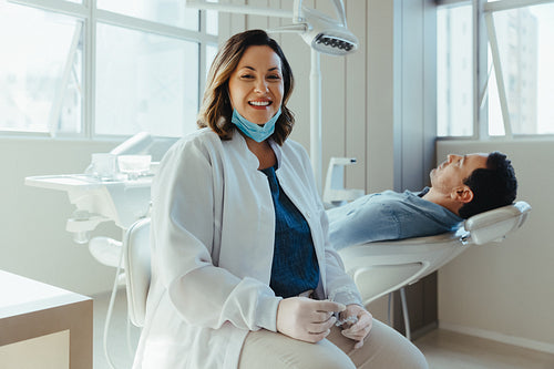 Female dentist with patient in a modern dental office