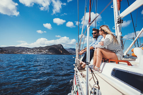 Young couple on a boat ride in the open ocean