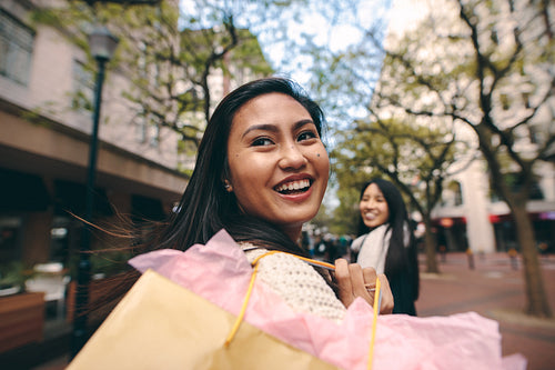 Happy asian women having fun shopping