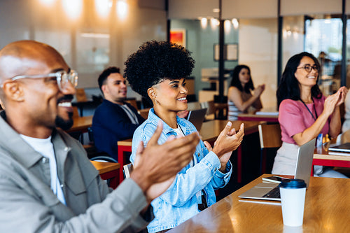 Business people applauding in a meeting