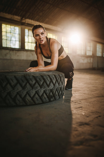 Woman taking a break from cross training workout
