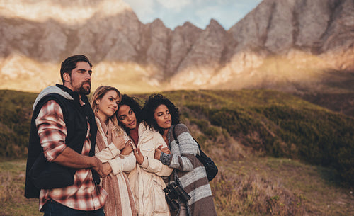 Friends on holiday looking at a landscape