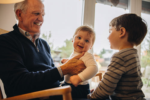 Kids having a great time with their grandfather