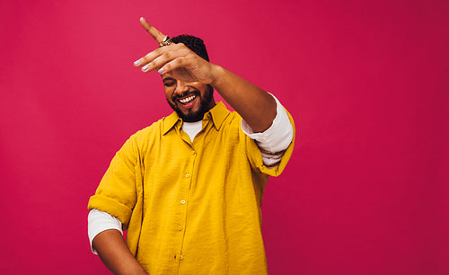 Young man dancing to music in a studio