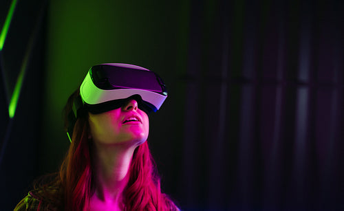 Virtual reality exploration: Young woman wearing a VR headset