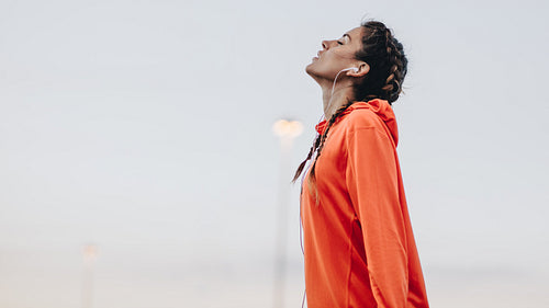 Female having workout break outdoors