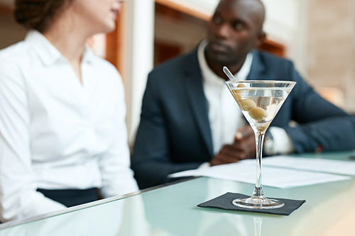 Glass of cocktail on cafe counter